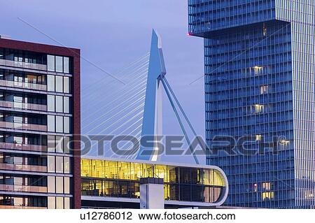 Netherlands, Rotterdam, Modern building with bridge in background View Large Photo Image Stock Image - Netherlands, Rotterdam, Modern building with bridge in background. Fotosearch