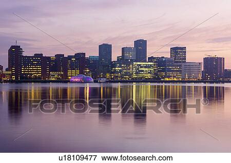 Stock Photo - Netherlands, Rotterdam, Waterfront at sunrise. Fotosearch