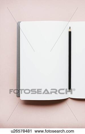 Pencil on open notebook View Large Photo Image Stock Image - Pencil on open notebook. Fotosearch