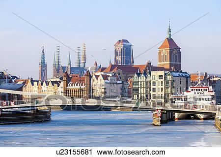 Stock Image - Poland, Pomerania, Gdansk, Frozen Vistula river and cityscape. Fotosearch