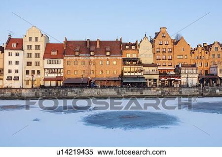Stock Photography - Poland, Pomerania, Gdansk, Frozen Vistula river and townhouses. Fotosearch