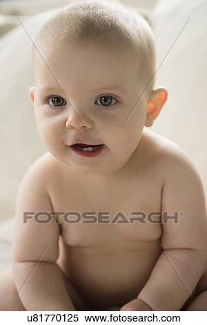 Stock Photography - Portrait of baby girl (12-17 months). Fotosearch