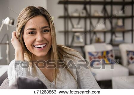 Portrait of smiling young woman View Large Photo Image Stock Image - Portrait of smiling young woman. Fotosearch
