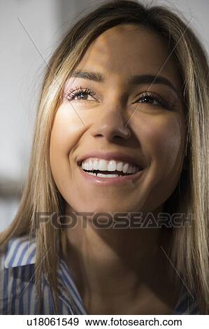 Stock Photo - Portrait of smiling young woman. Fotosearch