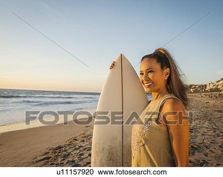 Portrait of woman with surfboard View Large Photo Image Stock Image - Portrait of woman with surfboard. Fotosearch