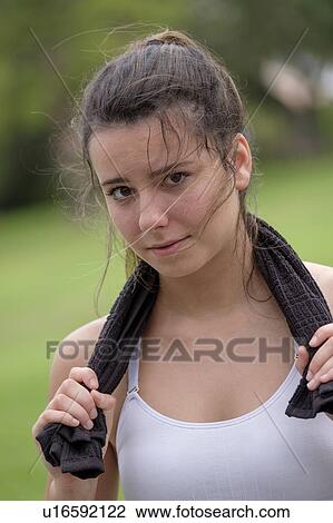 Portrait of young woman after work out View Large Photo Image Stock Image - Portrait of young woman after work out. Fotosearch