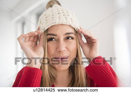 Portrait of young woman wearing knit hat View Large Photo Image Stock Photography - Portrait of young woman wearing knit hat. Fotosearch
