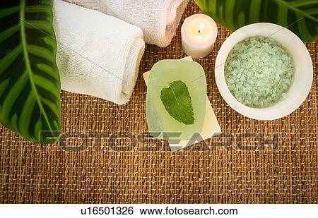 Stock Photograph - Sea salt and towel for spa treatment. Fotosearch