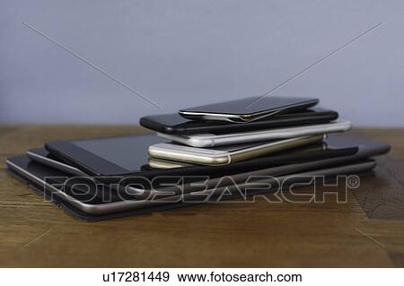 Stack of smart phones and digital tablets View Large Photo Image Stock Photo - Stack of smart phones and digital tablets. Fotosearch