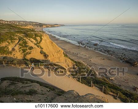 USA, California, Newport Beach, Woman running along footpath View Large Photo Image Stock Image - USA, California, Newport Beach, Woman running along footpath. Fotosearch