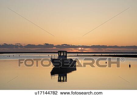 USA, Massachusetts, Cape Cod, Chatham, Fishing boat reflecting in water at dawn View Large Photo Image Stock Image - USA, Massachusetts, Cape Cod, Chatham, Fishing boat reflecting in water at dawn. Fotosearch