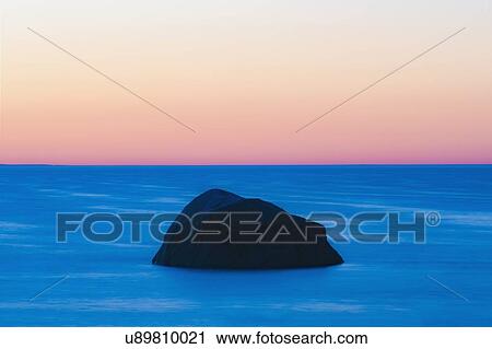 USA, Massachusetts, Cape Cod, Orleans, Rock in sea at sunset View Large Photo Image Stock Image - USA, Massachusetts, Cape Cod, Orleans, Rock in sea at sunset. Fotosearch