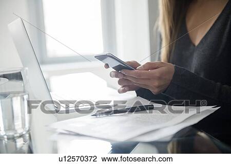 Young woman using smart phone View Large Photo Image Stock Image - Young woman using smart phone. Fotosearch