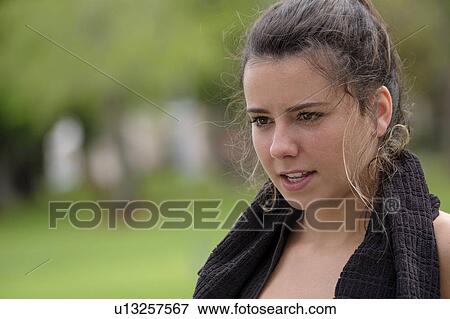 Young woman with towel around neck View Large Photo Image Stock Photo - Young woman with towel around neck. Fotosearch