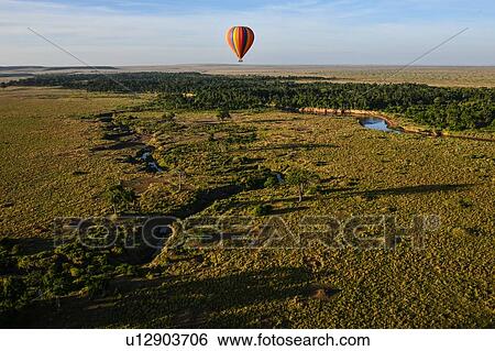 Air balloon floating over Mara River, Kenya View Large Photo Image Stock Photograph - Air balloon floating over Mara River, Kenya. Fotosearch