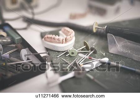 Artificial tooth and dental prosthesis being made. View Large Photo Image Stock Photograph - Artificial tooth and dental prosthesis being made.. Fotosearch