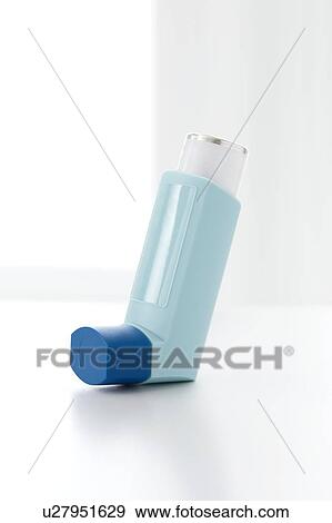 Stock Photo - Asthma inhaler against a white background.. Fotosearch