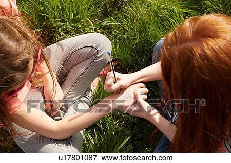 Best friends drawing dedication on hand View Large Photo Image Stock Photo - Best friends drawing dedication on hand. Fotosearch