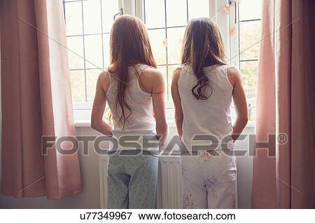 Stock Photo - Best friends waking up together. Fotosearch