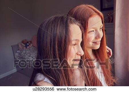 Stock Photograph - Best friends waking up together. Fotosearch