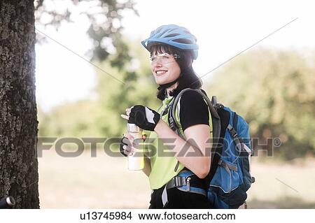 Biker stopping in park View Large Photo Image Picture - Biker stopping in park. Fotosearch