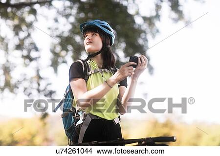 Biker stopping in park View Large Photo Image Picture - Biker stopping in park. Fotosearch