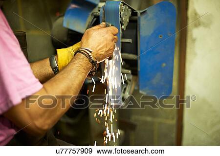 Stock Photo - Blacksmith working in his forge. Fotosearch