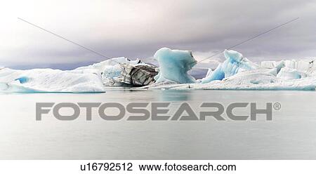 Blue icebergs in Jokulsarlon glacial lagoon, Iceland. View Large Photo Image Stock Image - Blue icebergs in Jokulsarlon glacial lagoon, Iceland.. Fotosearch