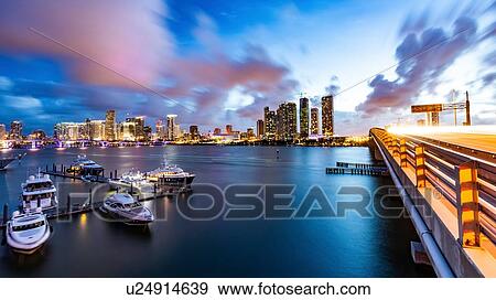 Stock Photo - Boats moored at dock, cityscape in background, Miami, Florida, USA. Fotosearch