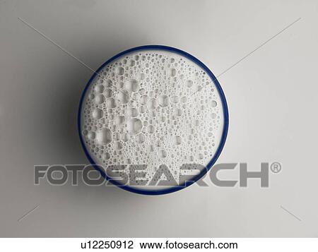 Stock Image - Bowlful of frothy milk. Fotosearch