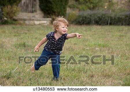 Boy eagerly pointing with finger View Large Photo Image Stock Image - Boy eagerly pointing with finger. Fotosearch