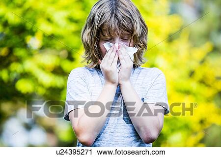 Boy using handkerchief while sneezing. View Large Photo Image Stock Image - Boy using handkerchief while sneezing.. Fotosearch
