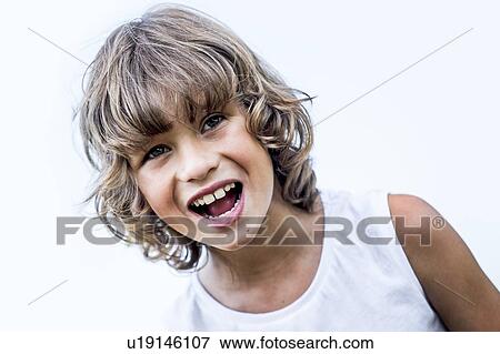 Stock Photo - Boy with blonde hair shouting in park.. Fotosearch