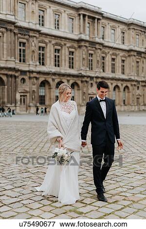 Bride and bridegroom on cobblestone street, Paris, France View Large Photo Image Stock Photo - Bride and bridegroom on cobblestone street, Paris, France. Fotosearch