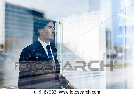 Businessman inside lift View Large Photo Image Stock Image - Businessman inside lift. Fotosearch