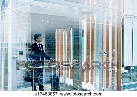 Stock Photo - Businessman leaving on business trip. Fotosearch