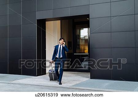 Businessman leaving on business trip View Large Photo Image Stock Photo - Businessman leaving on business trip. Fotosearch