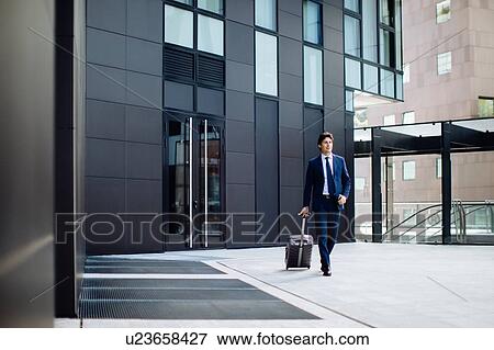 Stock Photo - Businessman leaving on business trip. Fotosearch