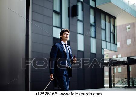 Stock Photograph - Businessman leaving on business trip. Fotosearch
