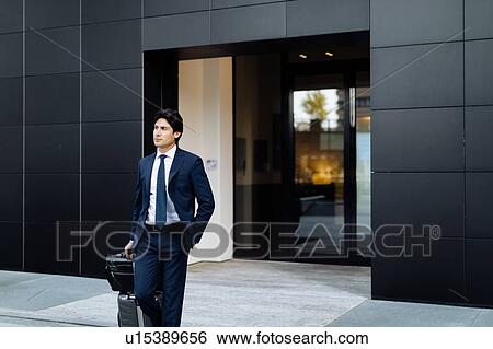 Stock Photograph - Businessman leaving on business trip. Fotosearch
