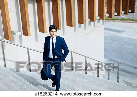 Businessman walking up stairway View Large Photo Image Picture - Businessman walking up stairway. Fotosearch