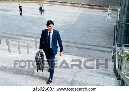 Businessman walking up stairway View Large Photo Image Stock Photo - Businessman walking up stairway. Fotosearch