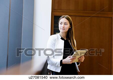 Businesswoman using digital tablet View Large Photo Image Stock Image - Businesswoman using digital tablet. Fotosearch