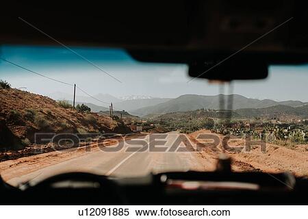 Car on the road through Atlas Mountains, Morocco View Large Photo Image Stock Photography - Car on the road through Atlas Mountains, Morocco. Fotosearch