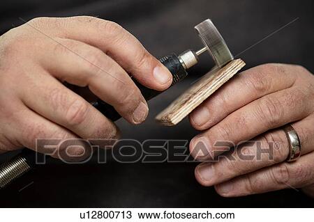 Carpenter sanding wood square with sanding tool View Large Photo Image Stock Image - Carpenter sanding wood square with sanding tool. Fotosearch