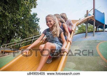 Children playing on slide View Large Photo Image Stock Photography - Children playing on slide. Fotosearch
