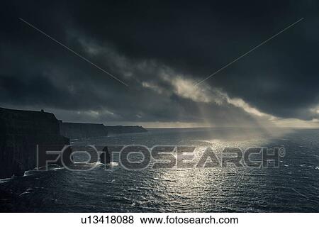 Stock Photo - Cliffs of Moher at sunset with hurricane Ophelia ap0oaching, Doolin, Clare, Ireland. Fotosearch