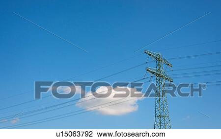 Stock Image - Cloud floating behind power pylon. Fotosearch