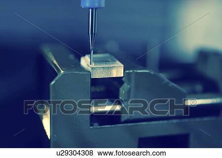 Stock Photo - CNC milling machine in use.. Fotosearch