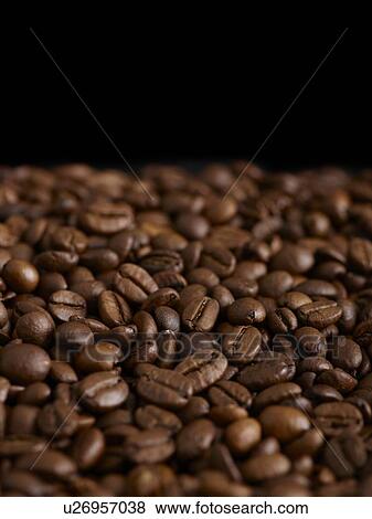 Stock Photo - Coffee beans against a black background.. Fotosearch